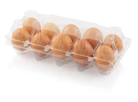 Chicken eggs in a plastic container Stock Photos