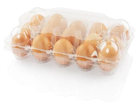 Chicken eggs in a plastic container Stock Photos