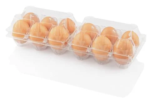 Chicken eggs in a plastic container Stock Photos