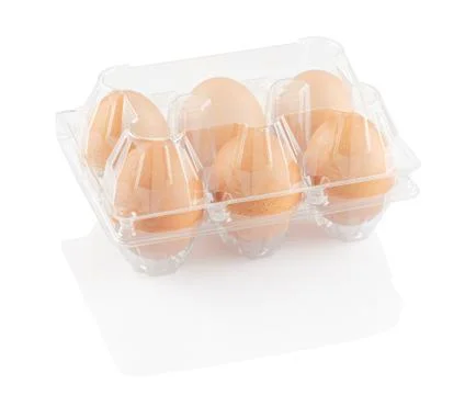 Chicken eggs in a plastic container Stock Photos