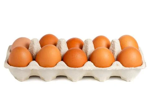 Chicken eggs in plastic container Photos
