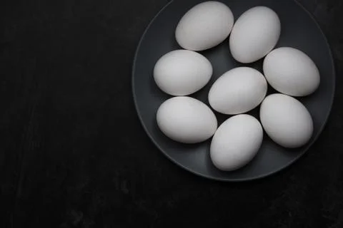 Chicken eggs on a plate Stock Photos