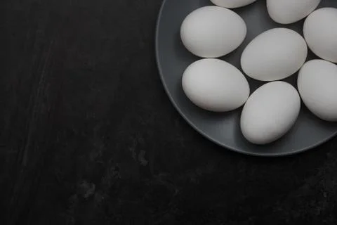 Chicken eggs on a plate Stock Photos