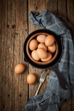 Chicken eggs on the table. Stock Photos