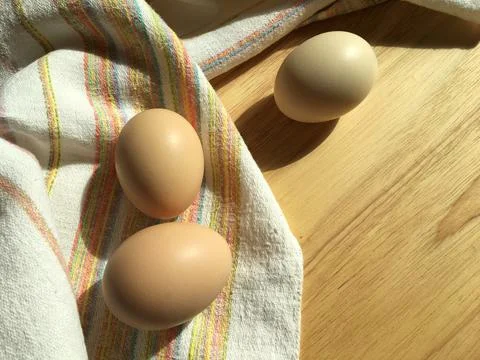 Chicken eggs on the table Stock Photos