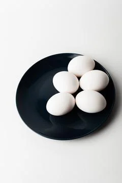 Chicken eggs  on a white background Stock Photos