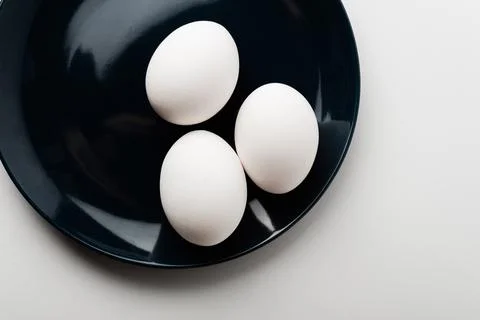 Chicken eggs  on a white background Stock Photos