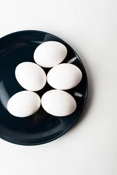 Chicken eggs  on a white background Stock Photos