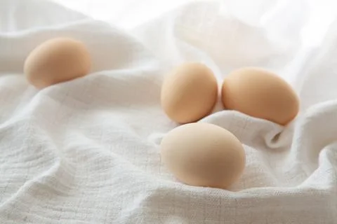 Chicken eggs on white background, selective focus. Happy easter background. Stock Photos