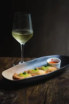 Chicken Empanadas La abuela style pastry puffs, spinach, green chimichurri sa Stock Photos
