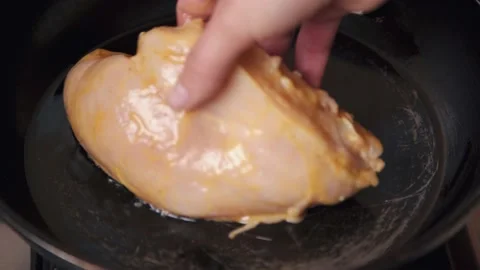 Chicken fillet is fried in a pan. Stock Footage 161114972