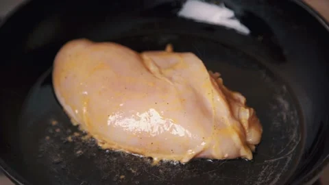 Chicken fillet is fried in a pan. Stock Footage 161114986
