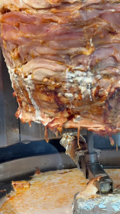 Chicken fillet on a spit. Making shawarma. Stock Footage 336915346