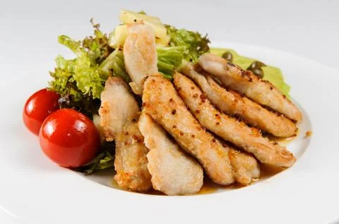 Chicken fillet with vegetables Stock Photos