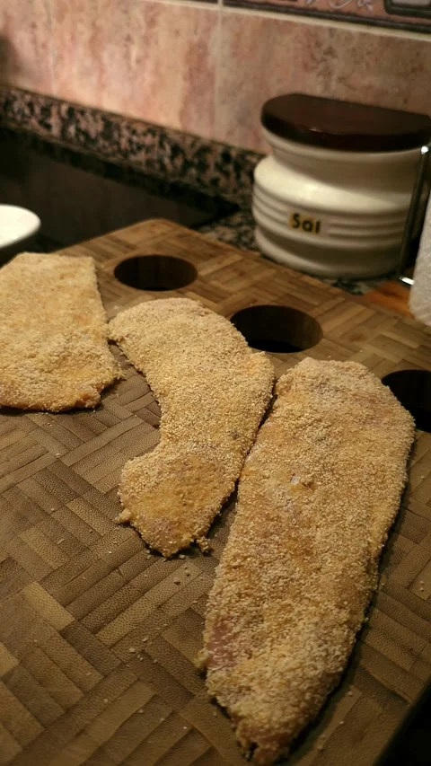 Chicken fillets breaded with flour and whisked eggs. Video stock 344857670
