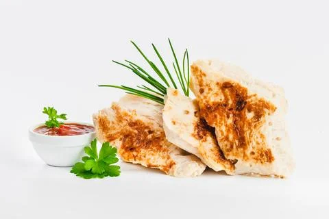Chicken fillets fried until half cooked, semi-finished product with fresh herbs Foto stock