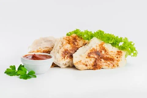 Chicken fillets fried until half cooked, semi-finished product with fresh herbs Stock Photos