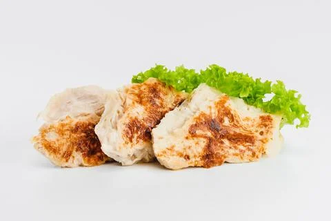 Chicken fillets fried until half cooked, semi-finished product with fresh herbs Stock Photos