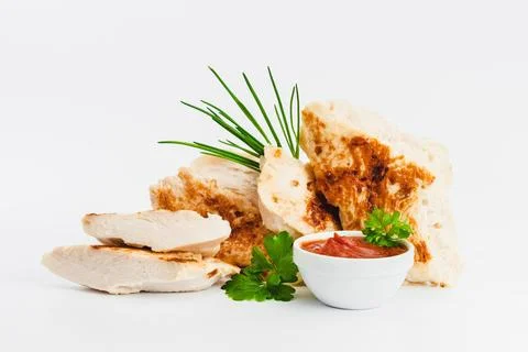 Chicken fillets fried until half cooked, semi-finished product with fresh herbs Stock Photos
