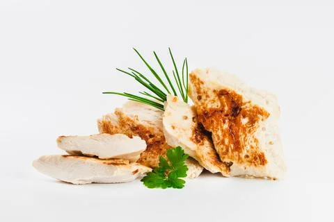 Chicken fillets fried until half cooked, semi-finished product with fresh herbs Stock Photos