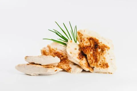Chicken fillets fried until half cooked, semi-finished product with fresh herbs Stock Photos