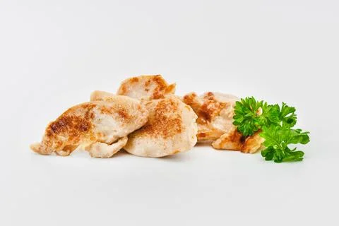 Chicken fillets fried until half cooked, semi-finished product with fresh herbs Stock Photos