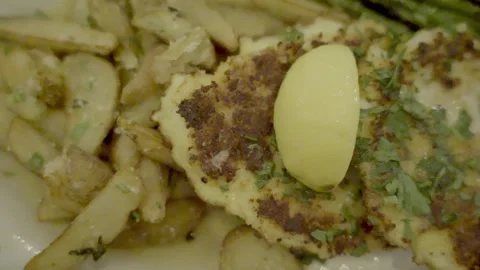 Chicken Francese Lemon Parsely close up slow motion pand right NJ 4K Stock Footage 274844348