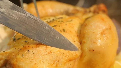 Chicken freshly cooked. Chef cutting breast Stock Footage 106828608