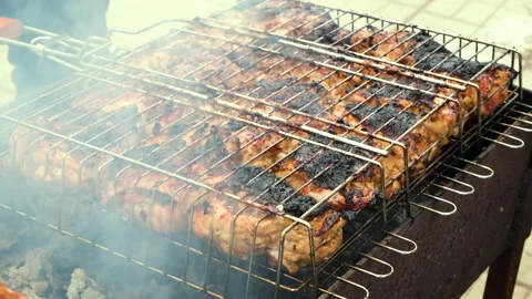 Chicken is fried on the grill. selective focus. Stock Footage 148645997