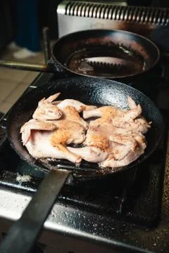Chicken fried in a pan Stock Photos