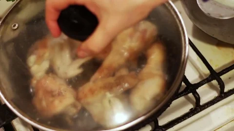 Chicken fried in a pan With toasted crust Stock Footage