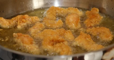 Chicken frying in a pan 2 Stock Footage 116015690
