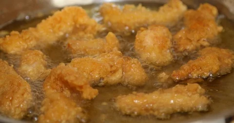 Chicken frying in a pan 5 Stock Footage 115996687