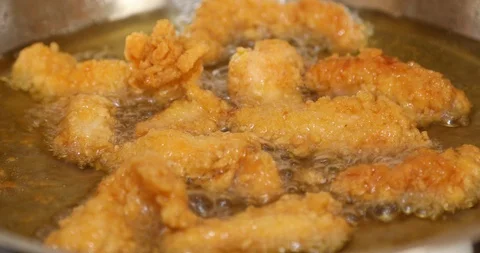 Chicken frying in a pan 7 Stock Footage 115996566
