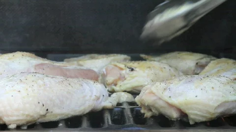 Chicken on gas grill low angle Video stock 544640