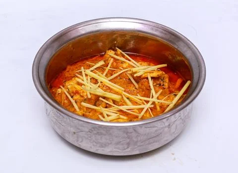 Chicken ginger handi served in dish isolated on grey background top view of.. Stock Photos