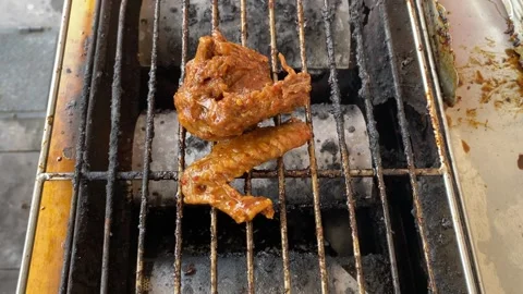 Chicken on grill Stock Footage 320923124