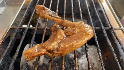 Chicken on grill Stock Footage 320923156