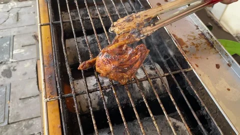 Chicken on grill Stock Footage 320923176