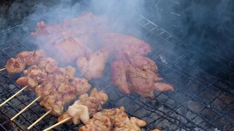 Chicken grill over the small flame. 4K, UHD. Видео 79872247