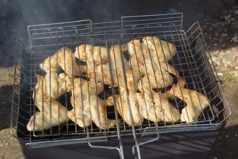 Chicken on a grill Stock Photos