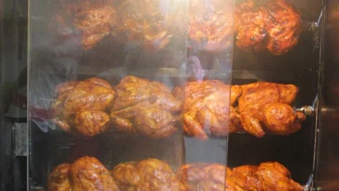 Chicken grill is processed in the big oven of a street shop 스톡 동영상 141776514