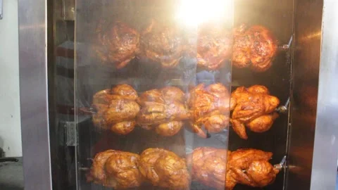 Chicken grill is processed in the big oven of a street shop 스톡 동영상 141776522