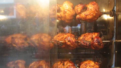 Chicken grill is processed in the big oven of a street shop 스톡 동영상 141776524