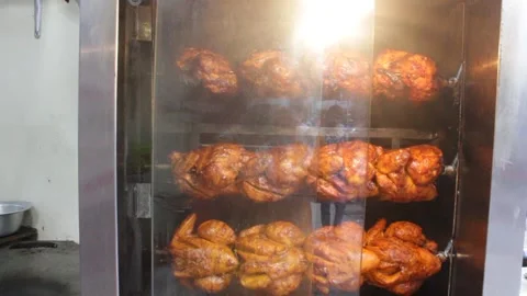 Chicken grill is processed in the big oven in a street shop 스톡 동영상 141776525
