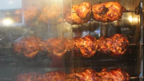 Chicken grill is processed in the big oven of a street shop 스톡 동영상 141776632