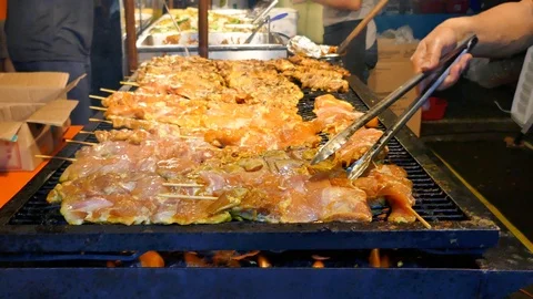 Chicken kabobs on a grill 4K Stock Footage 94497471