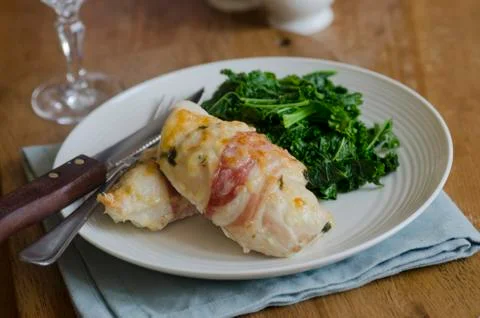 Chicken with kale Stock Photos