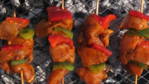 Chicken kebabs cooking on a BBQ Stock Footage 74603755