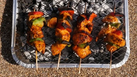 Chicken kebabs cooking on BBQ Stock-Footage 74603848